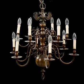 A patinated brass chandelier, first half of the 20th century. Height excl. chain ca 75 cm.