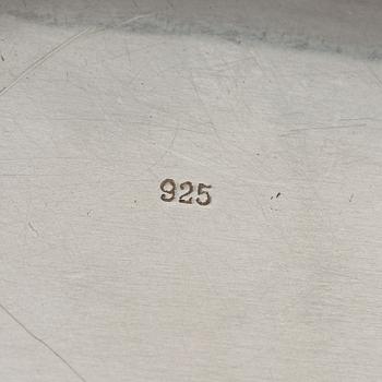 Three silver serving plates, decorated with "knots", Swedish import marks.