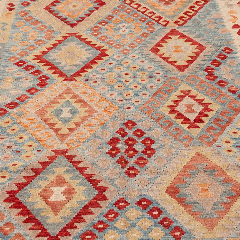 An oriental kilim, around 245 x 190 cm.