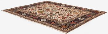 A semi-antique Tabriz carpet, Northwest Persia, of Safavid 'Vase' design, c.328 x 242 cm.