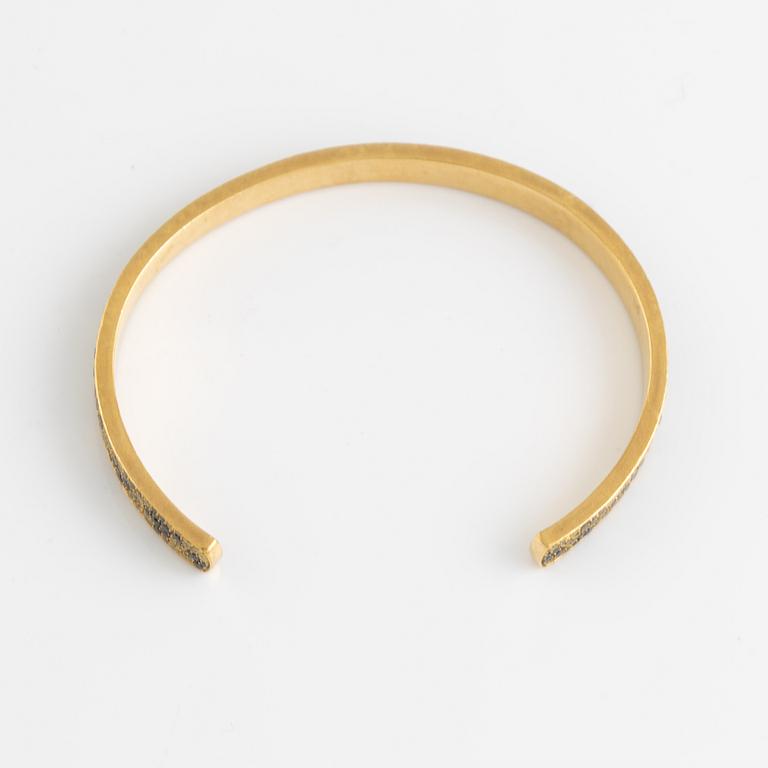 Crow's nest jewels, gold, black and yellow diamond and pear shaped tsavorite bangle.