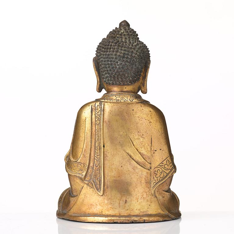 A gilt bronze figure of Amithaba Buddha, Ming dynasty (1368-1644).