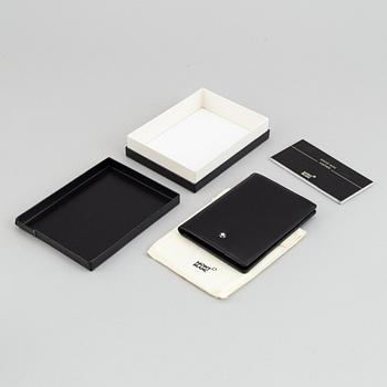 MOntblanc, a ball point pen and leather passport holder.