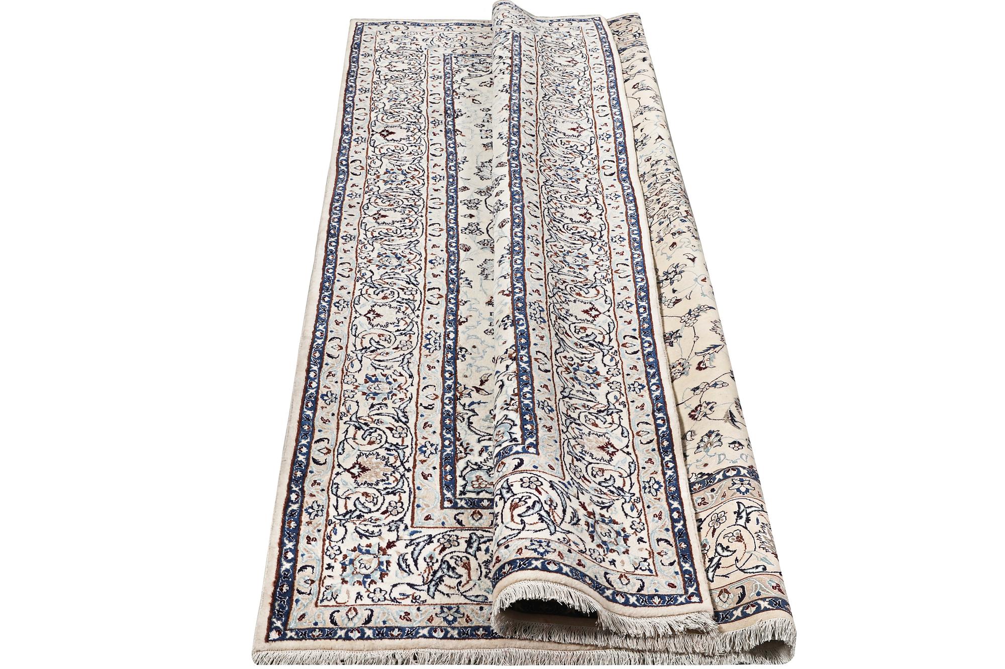 A Nain carpet, part silk, c. 294 x 193 cm.