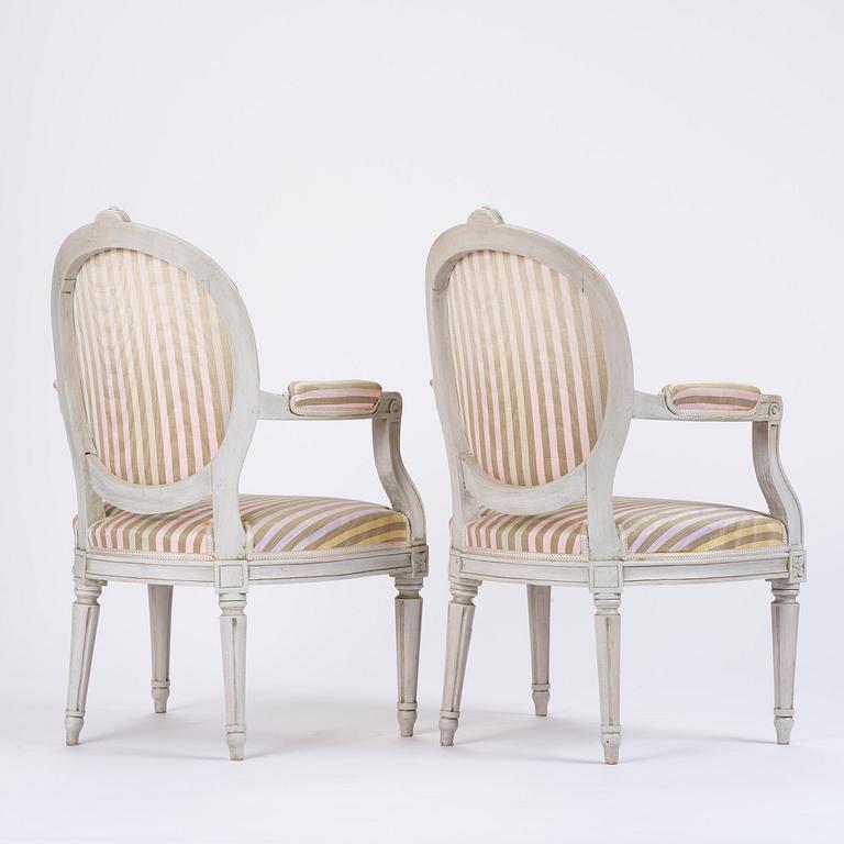 A pair of Gustavian open armchairs by E. Öhrmark (master in Stockholm 1777-1813).