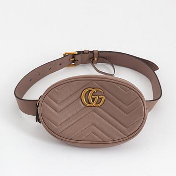 Gucci, a leather belt bag.