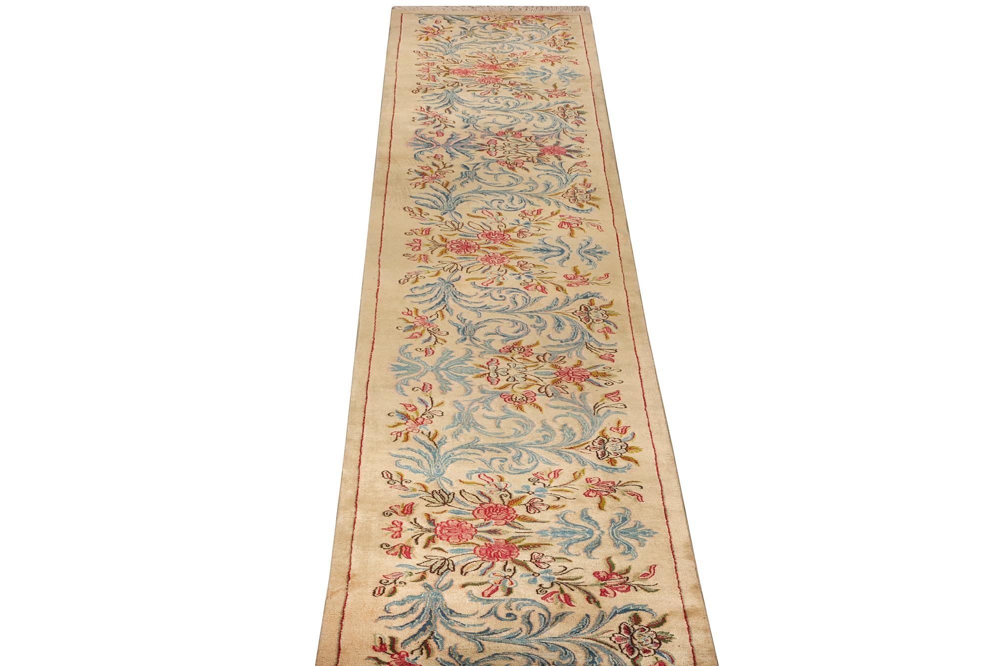 A semi-antique Keshan runner, c. 523 x 82 cm.