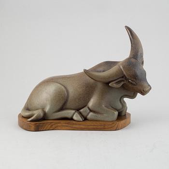 Gunnar Nylund, a stoneware sculpture of a reclining buffalo, Rörstrand, number 16/200.