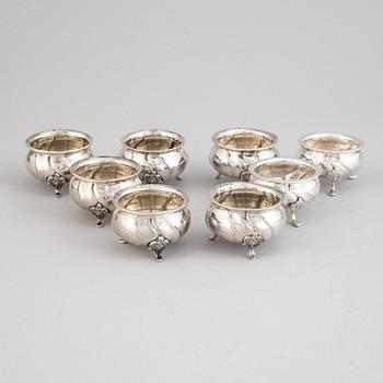 A set of eight rococo-style silver salt cellars, including CG Hallberg 1920.