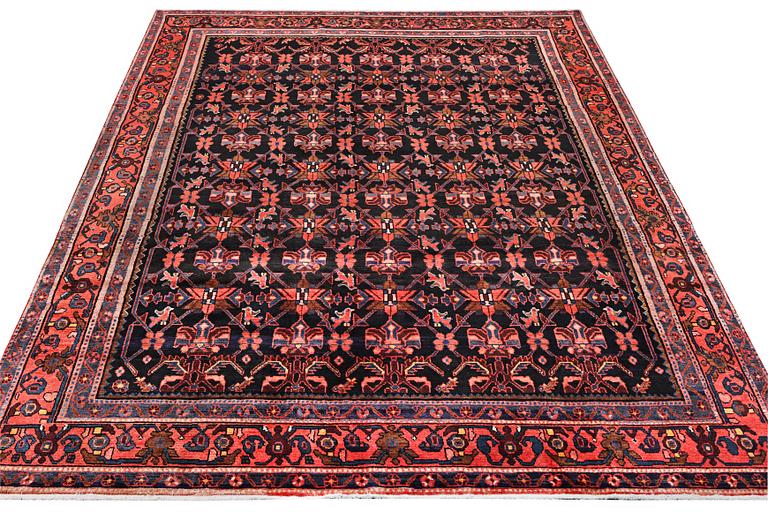 A Borujerd carpet, c. 300 x 225 cm.