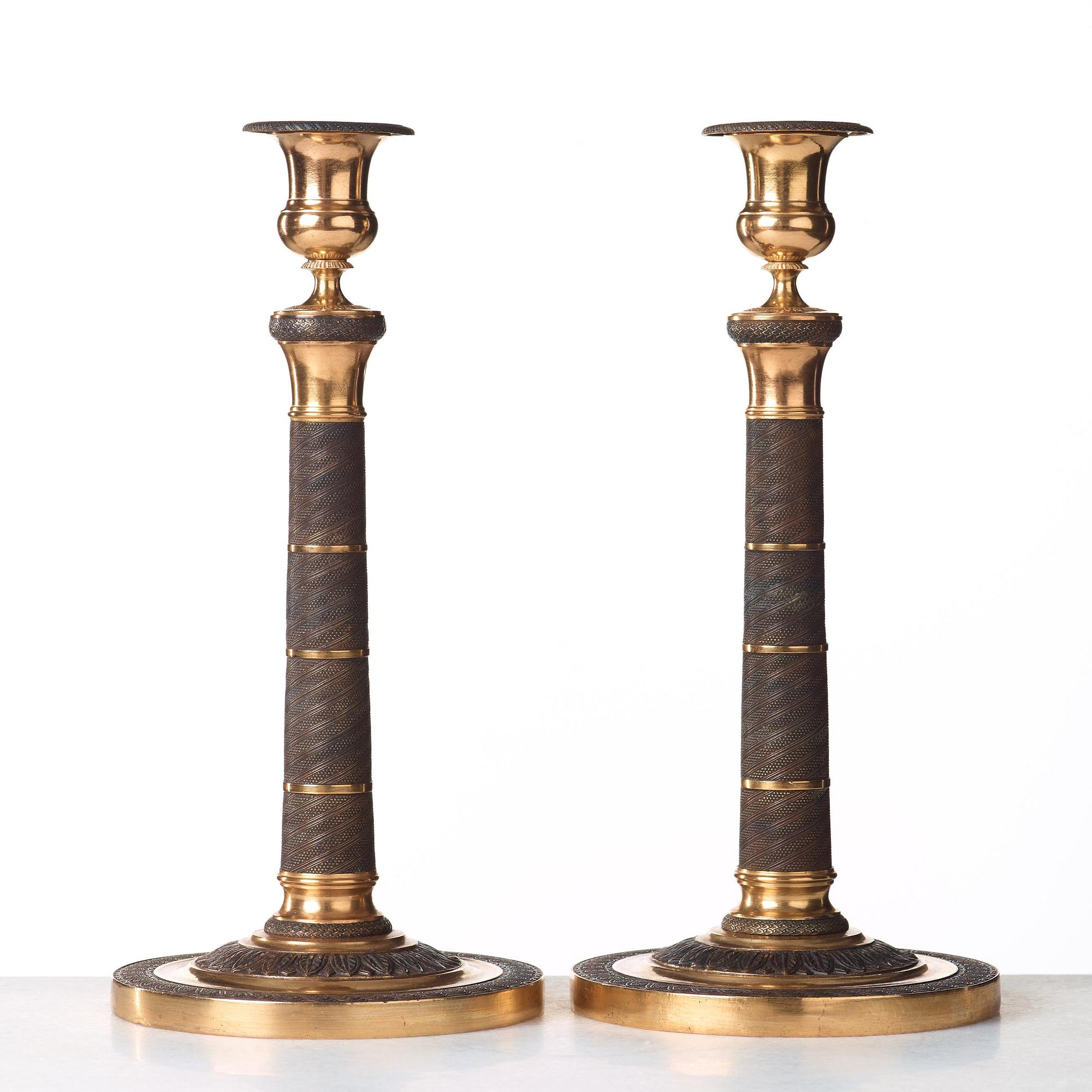 A pair of French Empire early 19th century candlesticks.