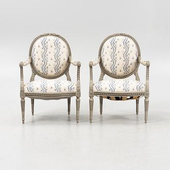 A pair of Gustavian style armchairs, 20th century.