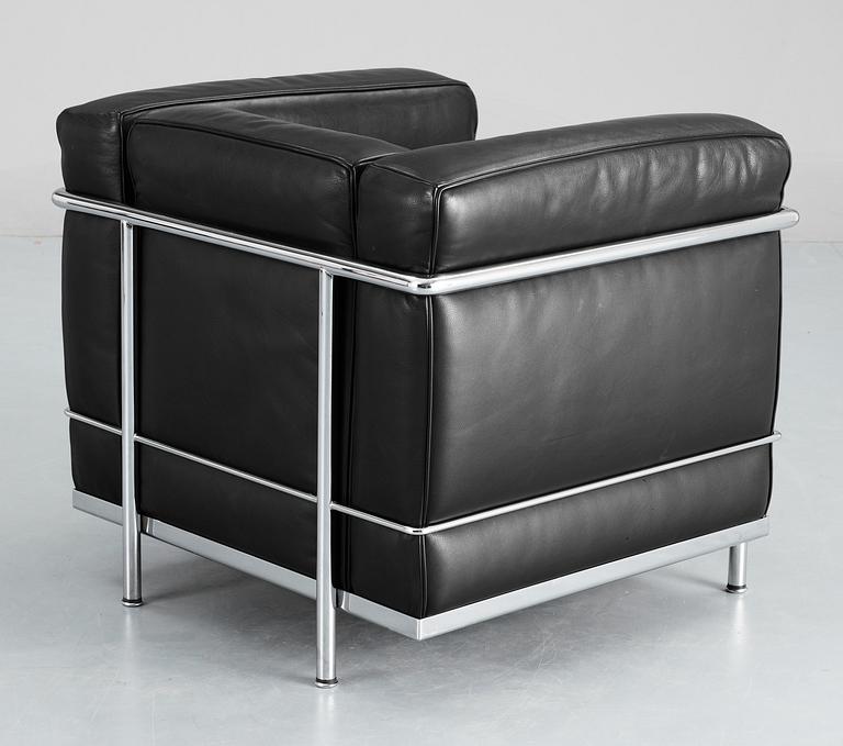 A pair of Le Corbusier 'LC 2' black leather and chromed steel easy chairs, Cassina, Italy.