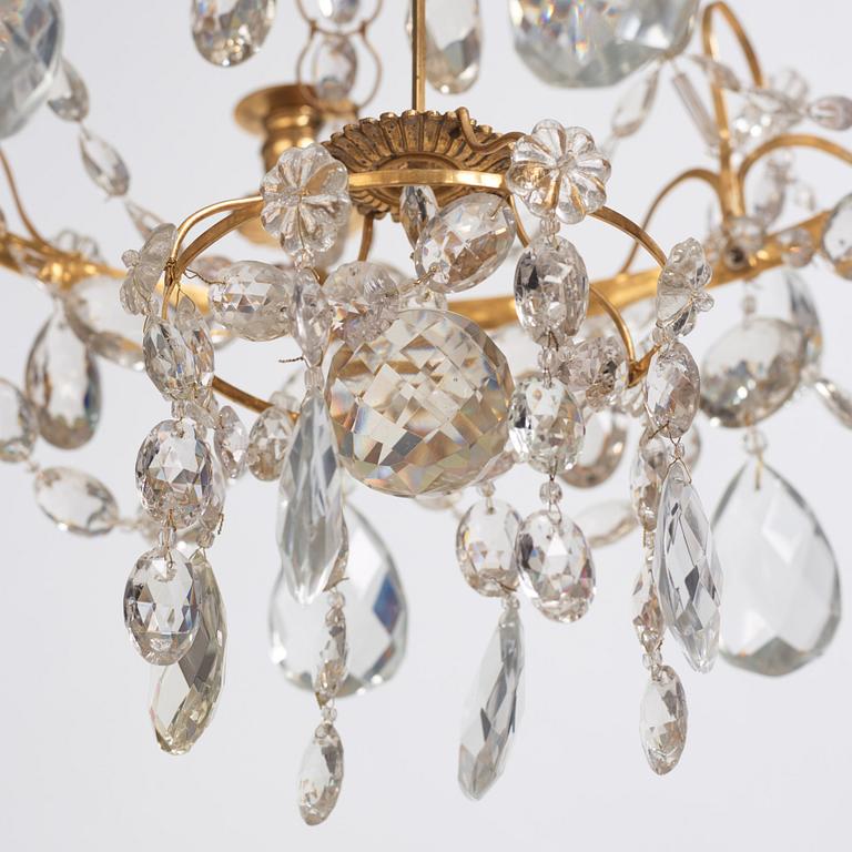 A Gustavian gilt-brass and cut-glass four-branch chandelier by O. Westerberg (master in Stockholm 1769-1881), dated 1795.