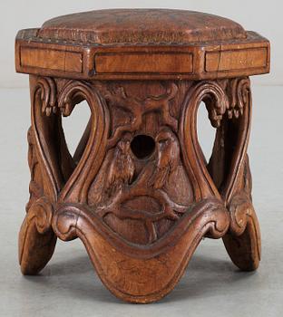 An Art Noveau sculptured pine stool probably by Knut Fjaestad, Sweden early 1900's.