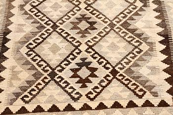 A kelim rug, 248 x 163 cm.