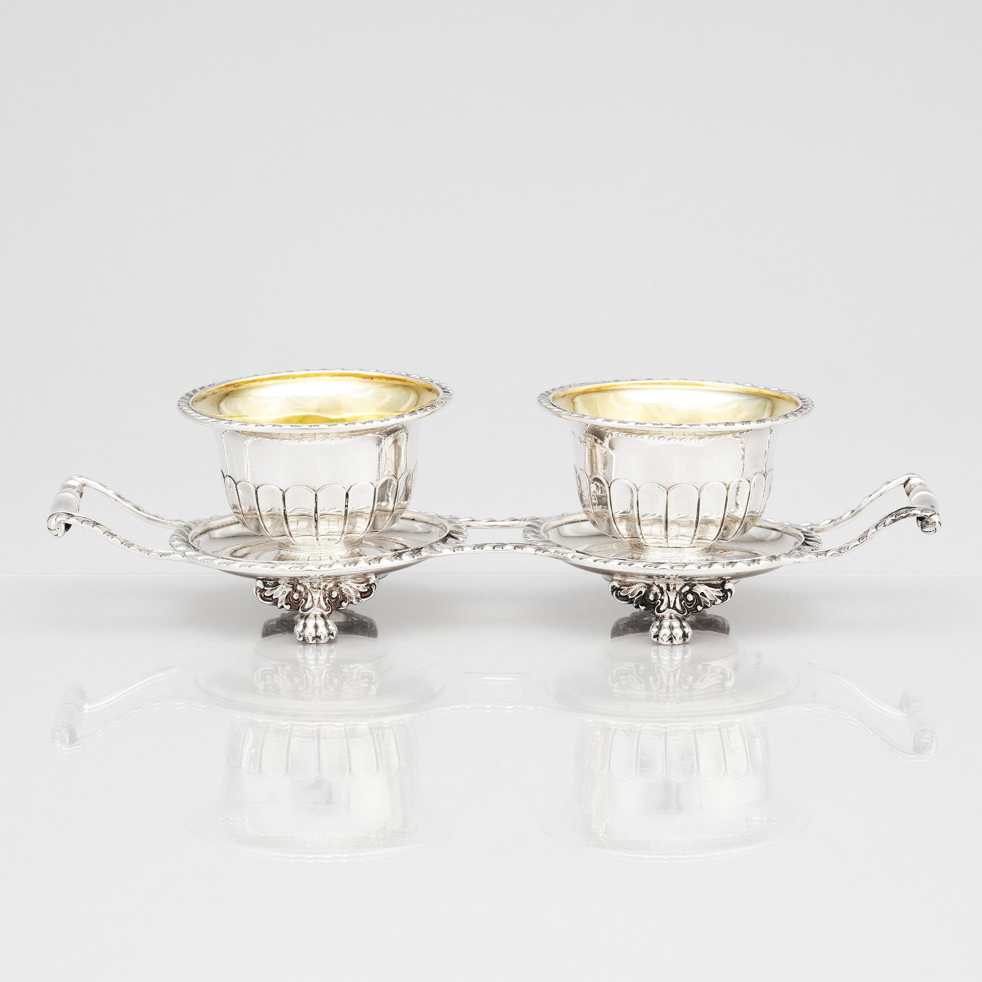 A pair of Swedish candy bowls with stand, parcel-gilt silver, mark of Gustaf Möllenborg, Stockholm 1851.