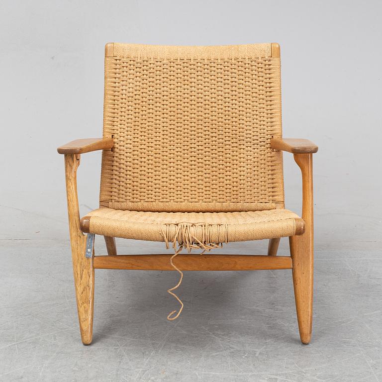 A 'CH-25' armchair designed by Hans J Wegner for Carl Hansen & Søn, Denmark.
