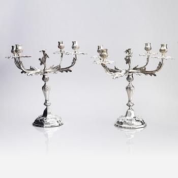 A pair of German 18th century silver candelabras, mark of C.C. Papcke, Stralsund.