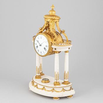 A Louis XVI marble and gilt bronze mantel clock, late 18th Century.