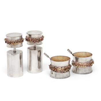 A Karl Heinz Sauer silver set of a pair of salts with spoons and a pair of spice grinders, Västerås, Sweden 1972.