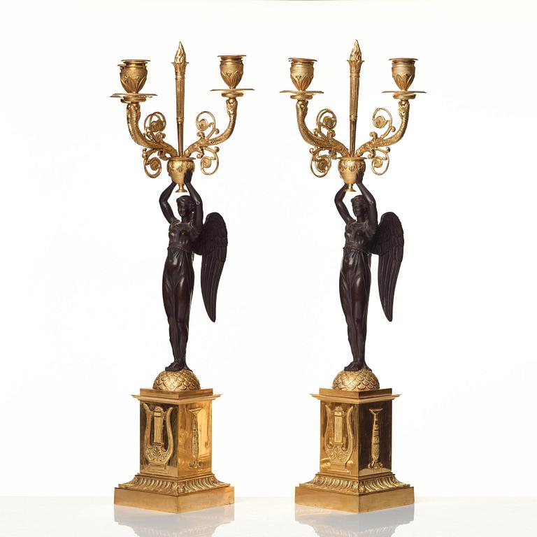 A pair of Empire three-light candelabra.