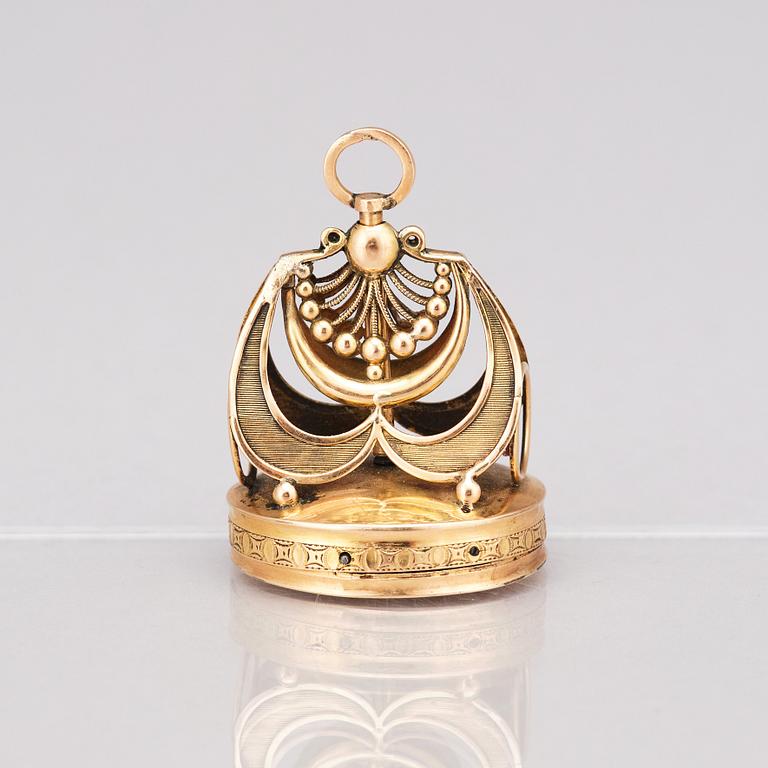 A gold musical fob seal. 19th Century.