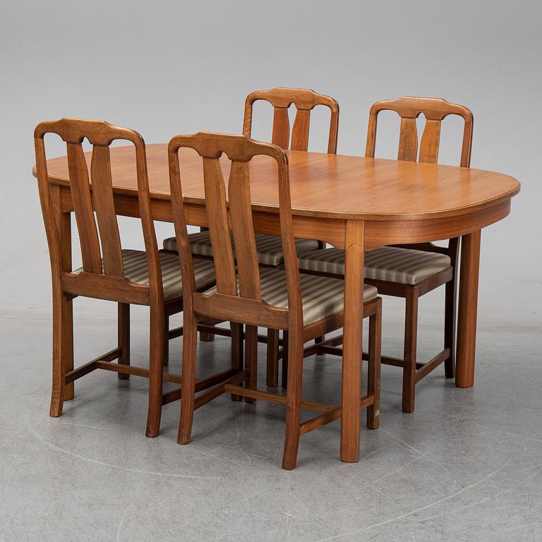 Carl Malmsten, A five-piece walnut 'Ambassadör' dining suite by Carl Malmsten.
