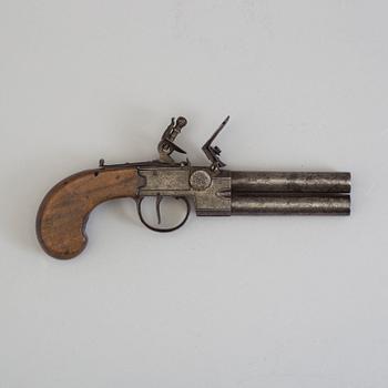 A British over-and-under flintlock pistol circa 1800.