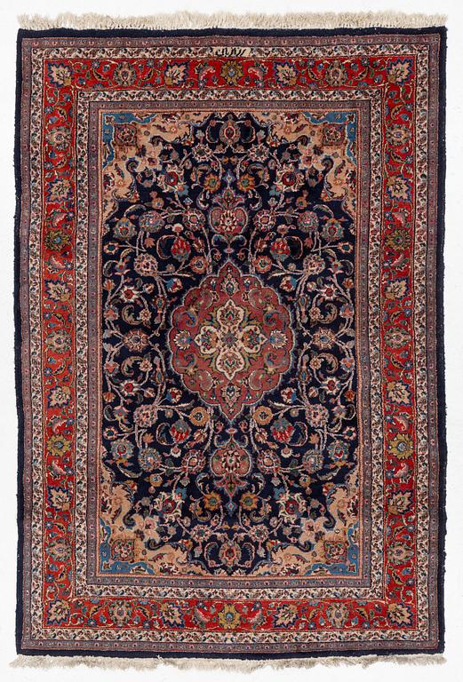 A Mashad carpet, signed, c. 289 x 198 cm.