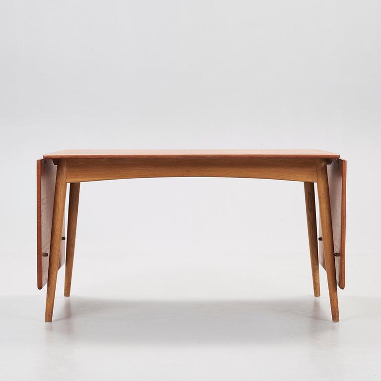 A Hans J Wegner teak and oak dinner table, Andreas Tuck, Denmark, 1950-60's.