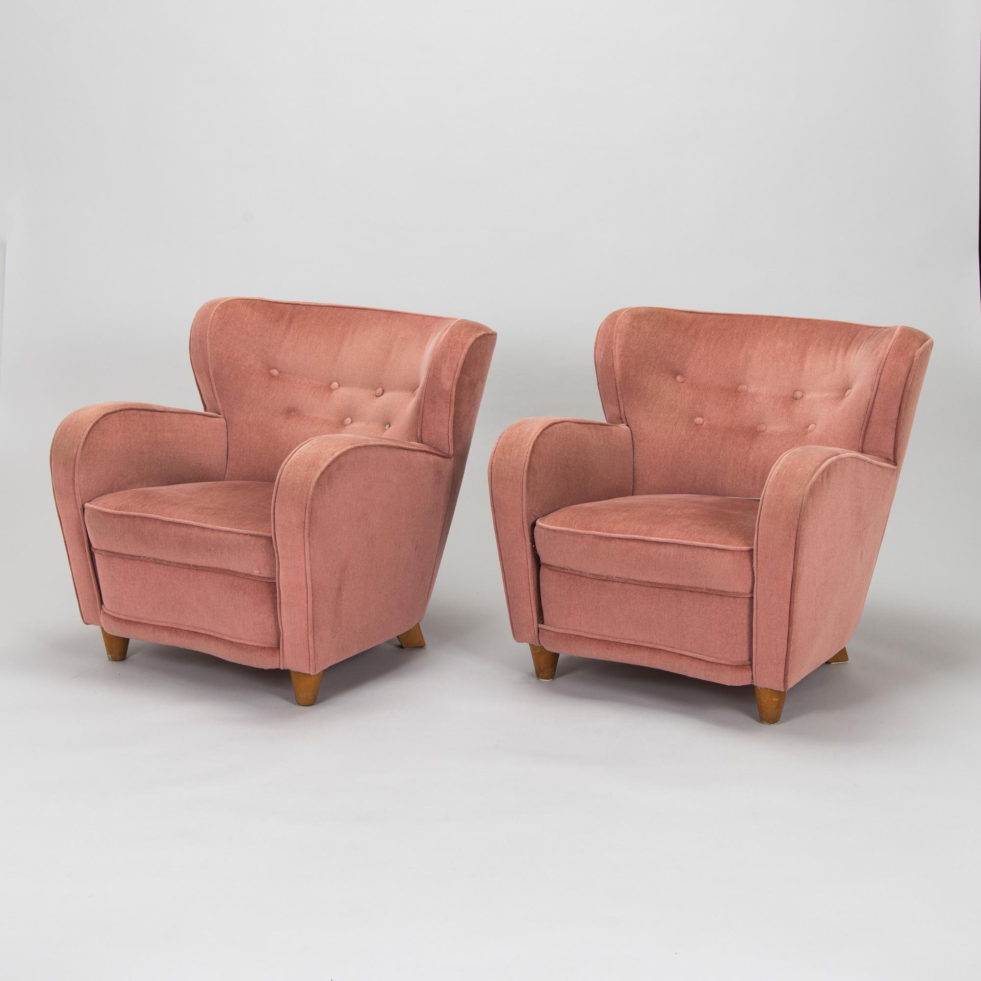 A pair of mid-20th century armchairs.