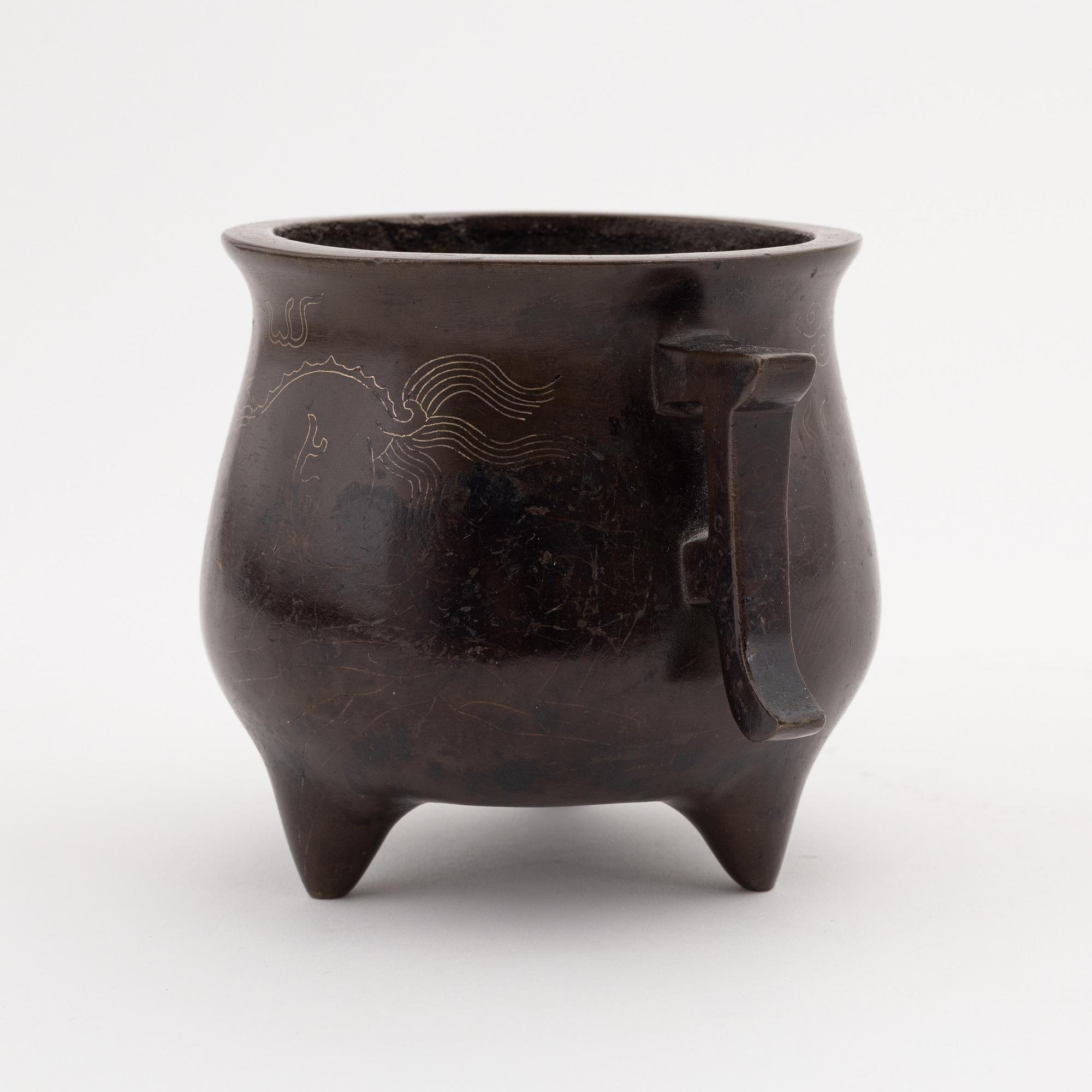 A Chinese tripod bronze censer, 20th century.