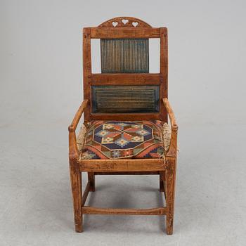 A 19th century folk art armchair.