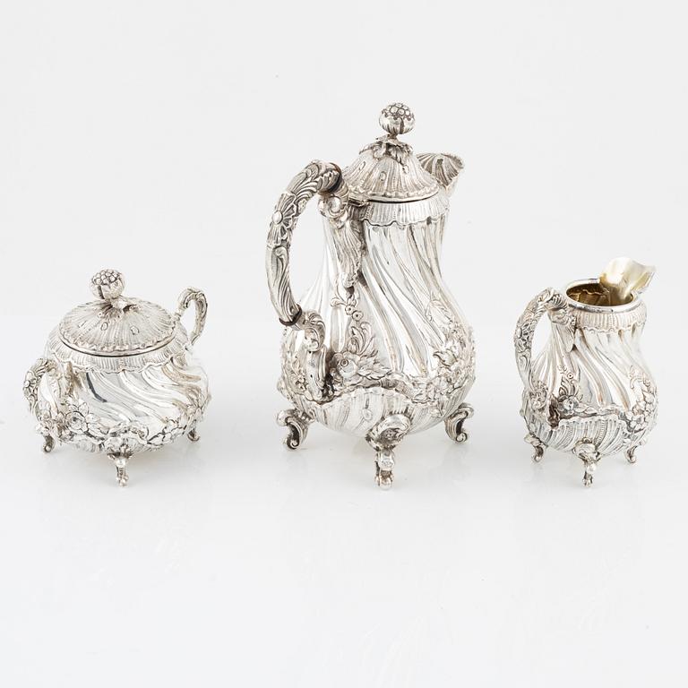 A Spanish Silver Rococo-Style Coffee Pot, Creamer and Sugar Bowl, first half of the 20th Century.