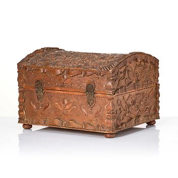 A baroque wedding casket, carved wood, dated 1725.