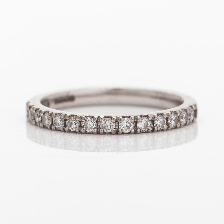 A platinum ring with brilliant cut diamonds.