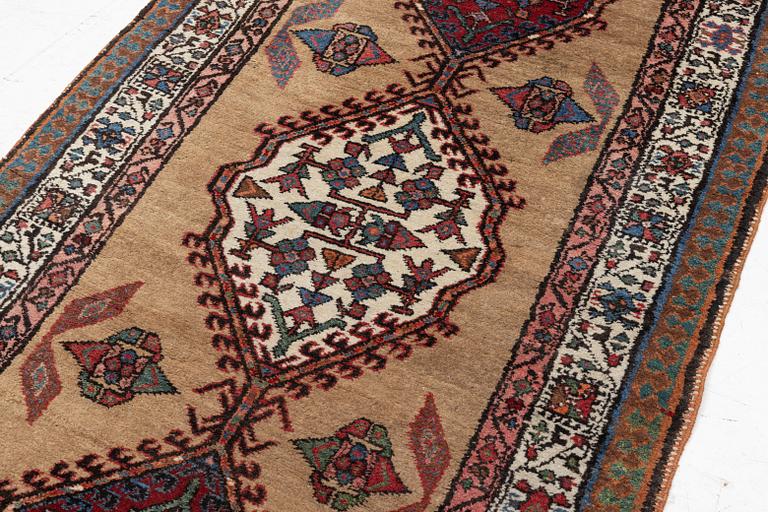 A runner carpet, possibly western Persia, c. 230 x 96 cm.