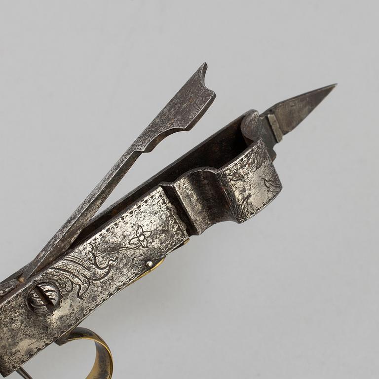 An 18th century candle scissor.