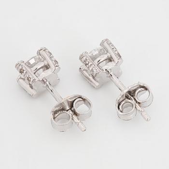 Brilliant-cut diamond stud earrings.