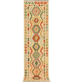 A Kilim runner carpet, c. 291 x 77 cm.