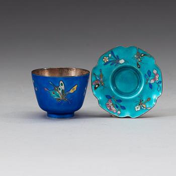 A set of 12 Chinese silver and enamel cups with saucers, decorated with birds and butterflies, China,early 20th Century.