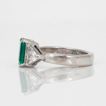 A circa 1.85ct emerald and trilliant-cut diamond ring.