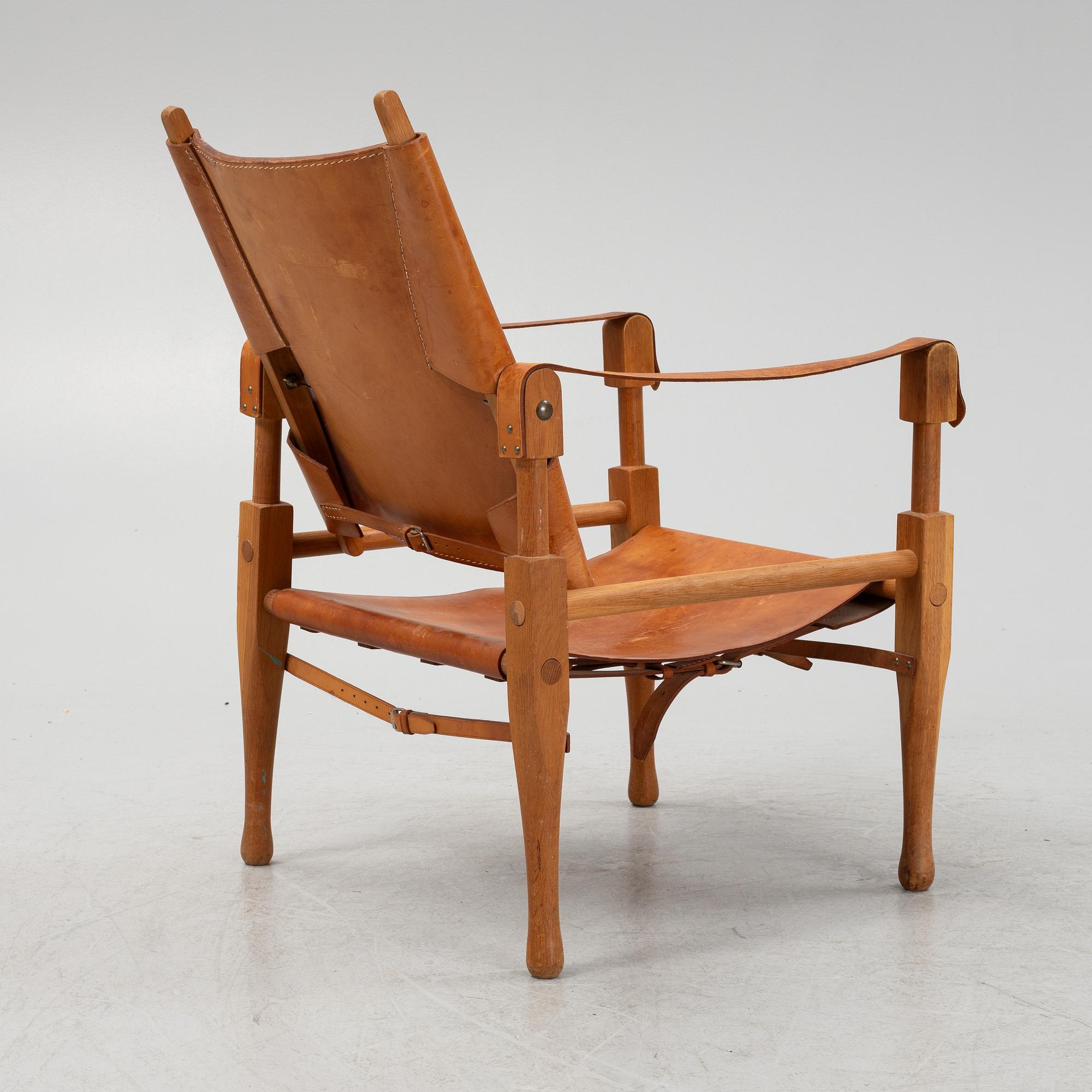 Scandianvian Modern, an oak and leather easy chair, mid 20th Century.