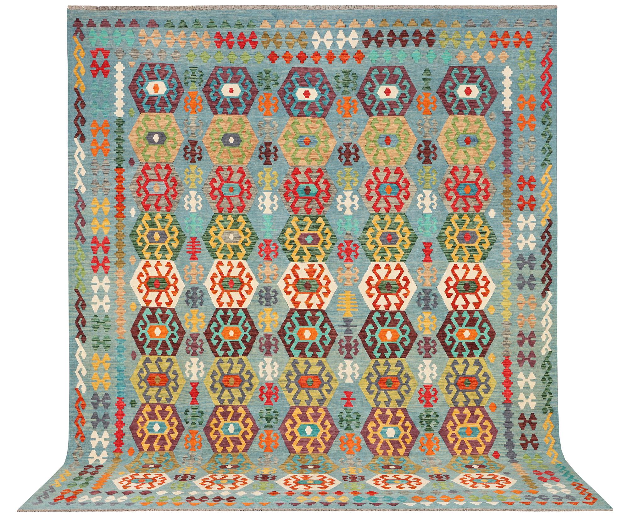 A Kilim carpet, c. 392 x 312 cm.