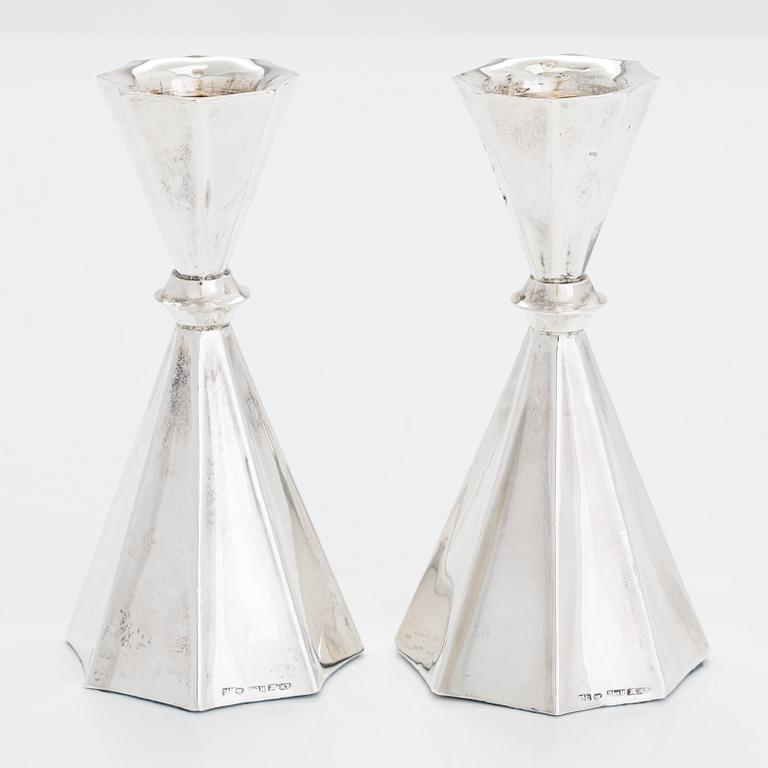 A 2-arm silver candle holder and a pair of silver candlesticks, Anna-Greta Eker and Hopearae Lasander, Turku 1965, 1963.