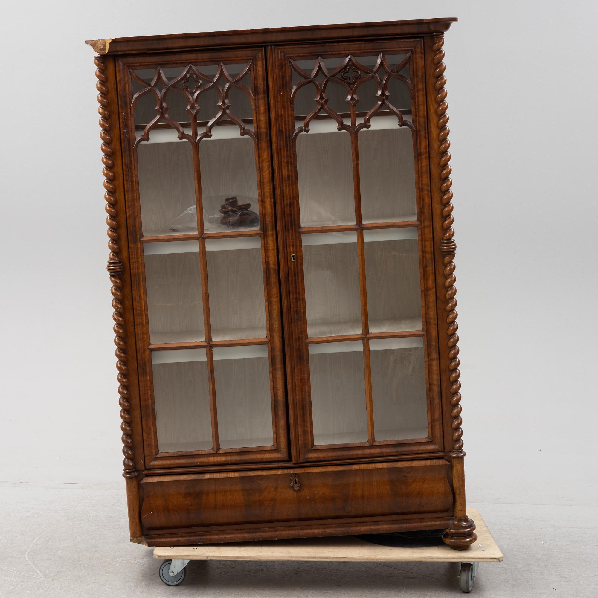 A mahogany veneered Gothic Revival cabinet, second half of the 19th Century.