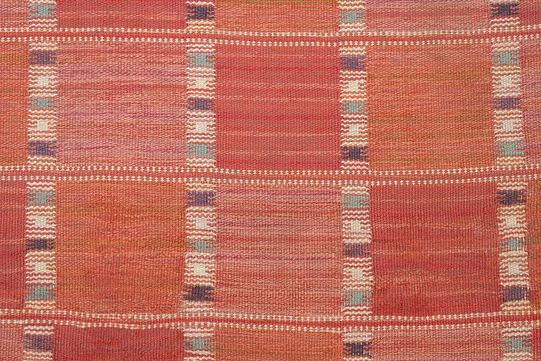 Barbro Nilsson, a carpet, 'Falurutan, röd Borås', flat weave, c. 502 x 212 cm, signed AB MMF BN.
