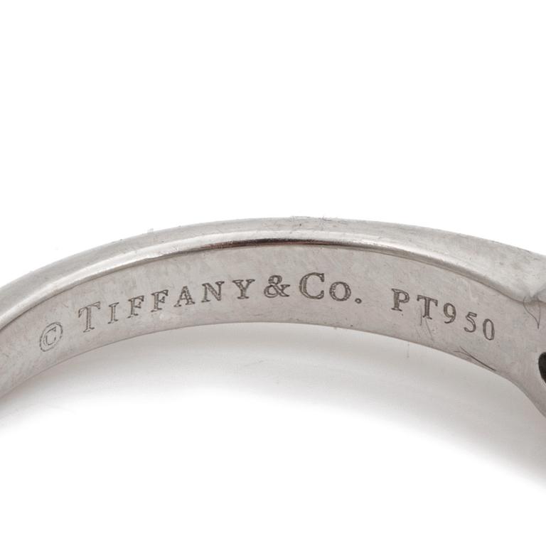 A ring set with a round, brilliant-cut diamond by Tiffany & Co.