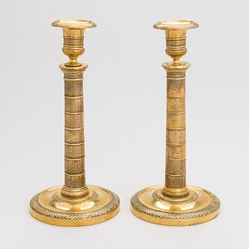 Two gilt brass candlesticks, Russia ca. 1820-1830.